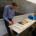 Sustainable food manager, Brent Wasser, prepares cheese plates for Spanish study abroad returnees