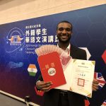 Will Murray holding award documents
