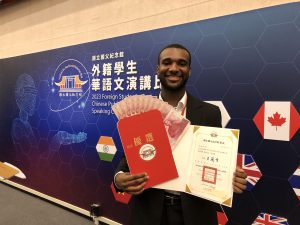 Will Murray holding award documents